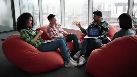 Designers working with digital car model on laptop in office Stock Footage 240800693