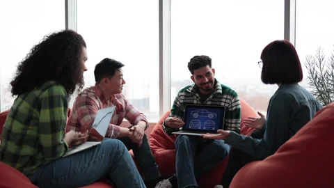 Designers working with digital car model on laptop in office Stock Footage 240806456