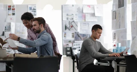 Designers working together in a creative office Stock Footage 86769360
