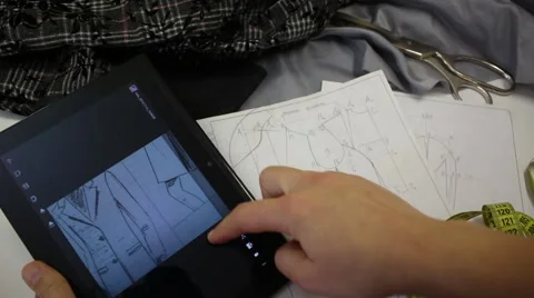 Designing and making clothes using digital tablet Vídeo Stock 56941030