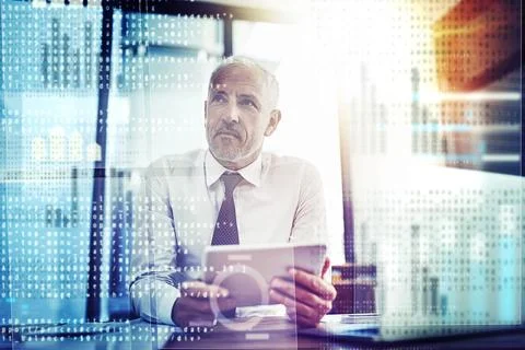 Designing a code thatll blow your mind. a mature businessman working on 写真素材