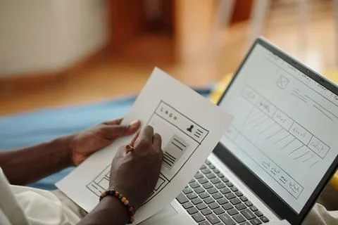 Designing User Interface on Laptop in Cozy Environment 스톡 사진