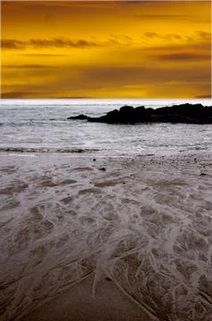 Designs in sand with dramatic sky Foto stock