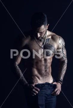 Desire with sexuality and attraction. Man stripper show sexy torso. Sportsman Stock Photos