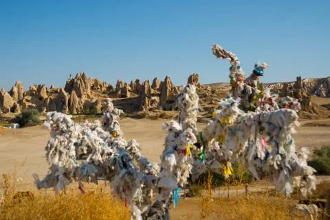 Desire tree in white strings. Rock churches and pigeon lofts. Sword valley, G Stock Photos