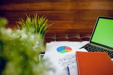 The desk and graph are placed on the business desk. Business concept With cop Stock-Fotos