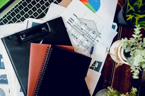 The desk and graph are placed on the business desk. Business concept With cop Stock Photos