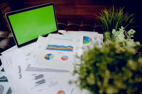 The desk and graph are placed on the business desk. Business concept With cop Stock-Fotos