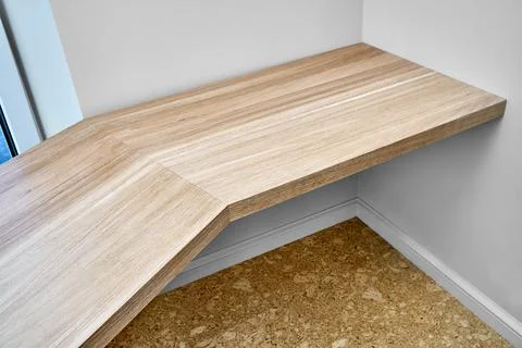 Desk with bleached solid oak mounted on white wall Stock Photos