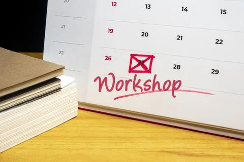 Desk calendar with the word Workshop written in red and a date marked with .. Stock Photos