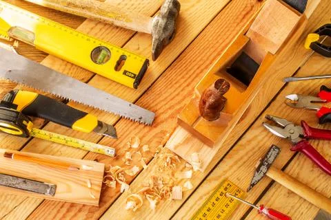 Desk of a carpenter with different tools. Stock Photos