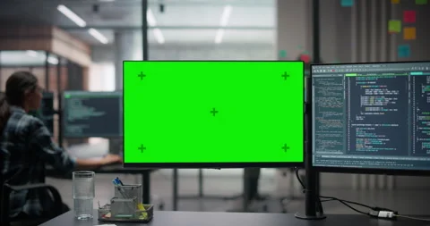 Desk with Computer Screens with Green Screen in Office Stock Footage 321012826