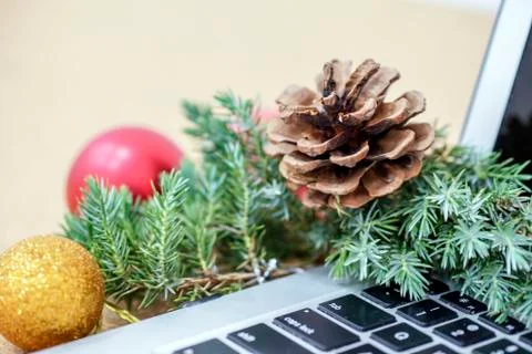 Desk during the holidays with Christmas decorations and a pen and notebook Stock Photos