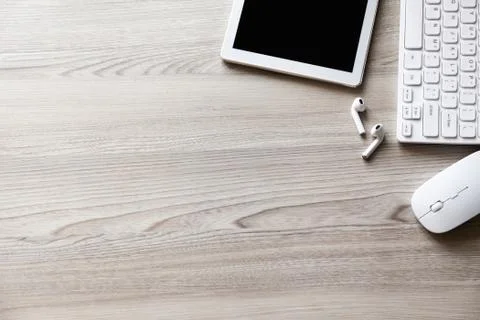 Desk flat lay view with keyboard, mouse and tablet pc Stock Photos