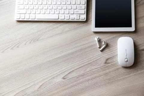 Desk flat lay view with keyboard, mouse and tablet pc Stock Photos