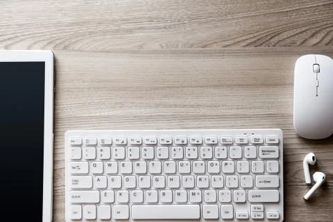 Desk flat lay view with keyboard, mouse and tablet pc Stock Photos