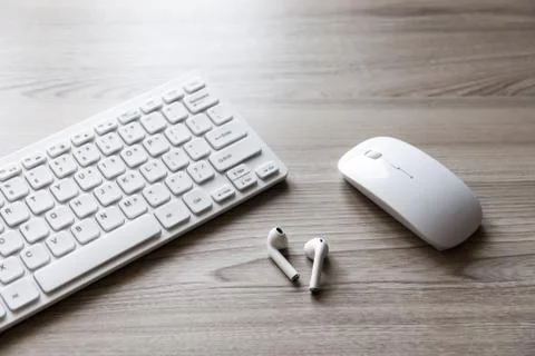 Desk flat lay view with keyboard, mouse and headphones Stock Photos