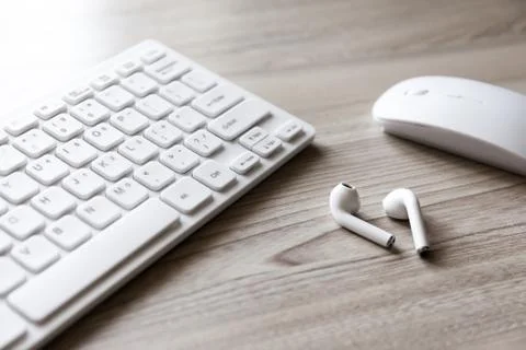 Desk flat lay view with keyboard, mouse and headphones Stock Photos