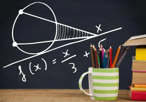 Desk foreground with blackboard graphics of math equations Foto stock