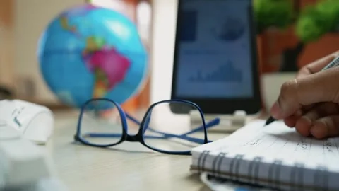 Desk with Glasses and Globe for Study or Work Stock Footage 318056623
