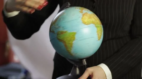 Desk globe rotating in hands Video stock 47940747