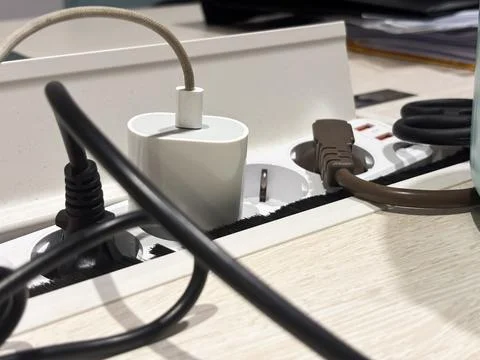Desk Integrated Power Socket Strip with Multiple Plugs and USB Ports in Modern Stock Photos