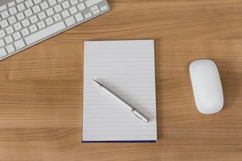 Desk with keyboard and notepad Stock Photos