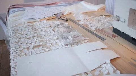 Desk with materials for sewing and a sewing machine. Stock Footage 128997145