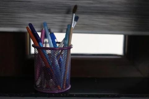 Desk organization with pens, brushes, for back to school themes Stock Photos