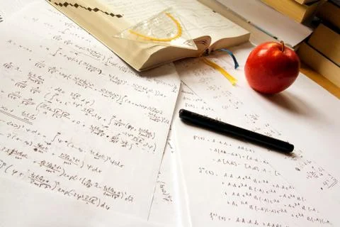 Desk with physics calculations Stock Photos