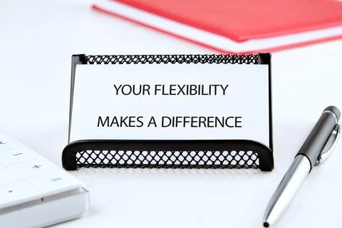 A desk setting featuring a sign that emphasizes the importance of flexibility Stock Photos