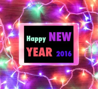 Desk view from above with digital tablet and xmas lights Foto stock