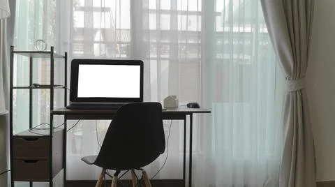 Desk by the window in the house Stock Photos