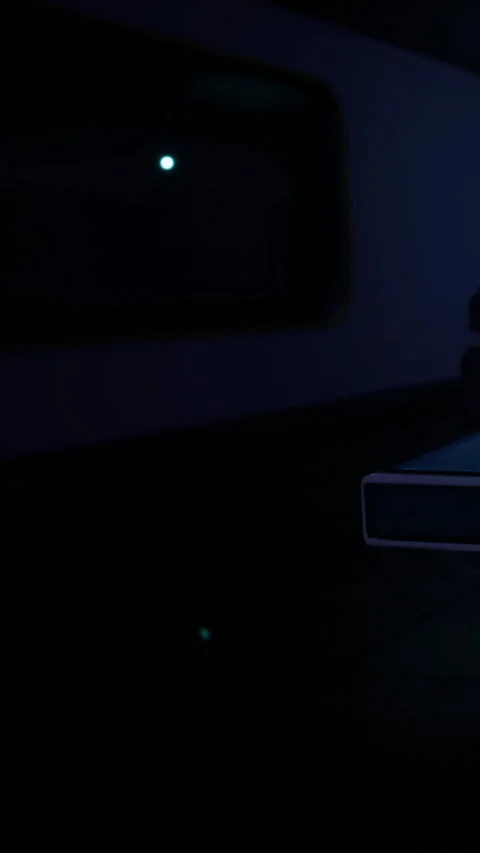 Desk workspace with glowing screen and items during late hours at night Stock Footage 336583451