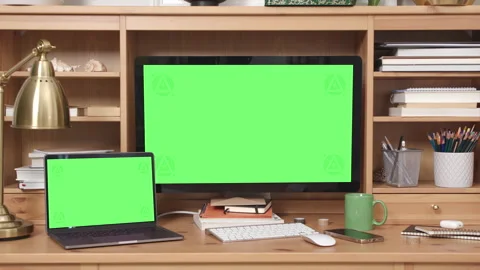 Desktop and Laptop Computers with Green Screen in Home Office Interior Video stock 172012411