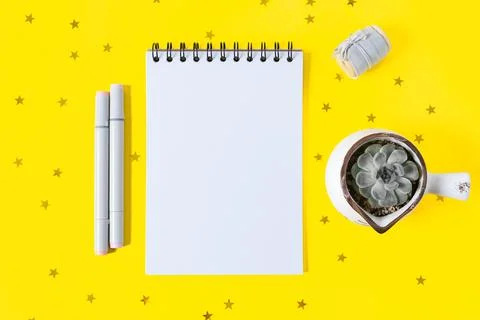 Desktop blank notepad with plants. Stock Photos