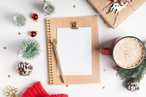 Desktop blank planner. Flat lay of white working table background with cup of Stock Photos