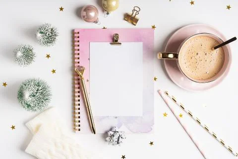 Desktop blank planner. Flat lay of white working table background with cup of Stock Photos