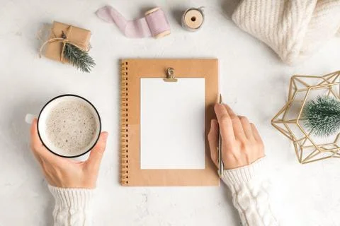 Desktop blank planner. Flat lay of white working table background with cup of Stock Photos