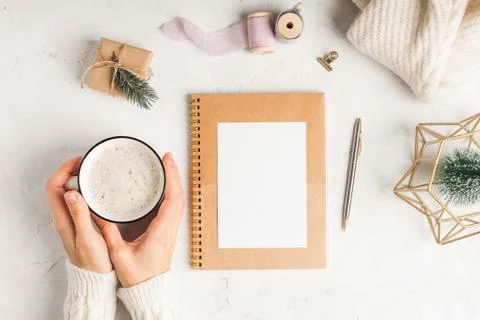 Desktop blank planner. Flat lay of white working table background with cup of Stock Photos