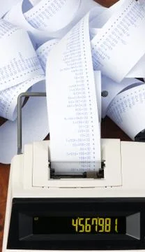 Desktop calculator with tape for computing costs, expenses, reve Stock Photos