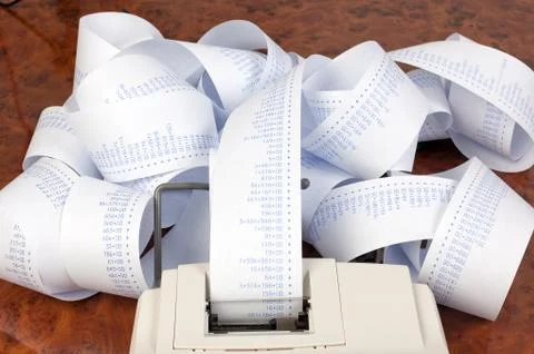 Desktop calculator with tape for computing costs Stock Photos