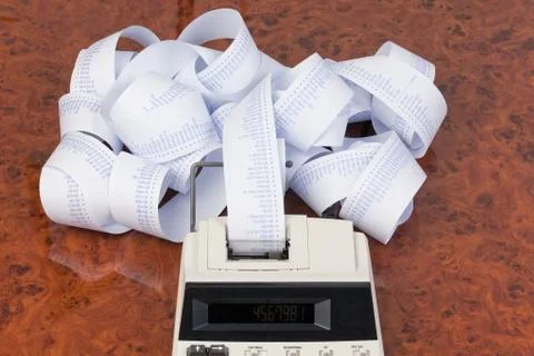 Desktop calculator with tape for computing costs, expenses, reve Stock Photos