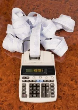 Desktop calculator with tape for computing costs, expenses, reve Stock Photos