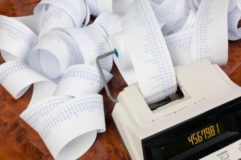 Desktop calculator with tape for computing costs, expenses, reve Stock Photos