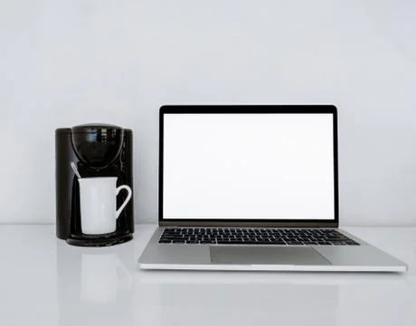 Desktop Coffee Maker with Laptop Concept Stock Photos
