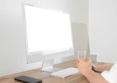 Desktop computer with blank screen mockup on wooden office table at workspa.. Foto stock