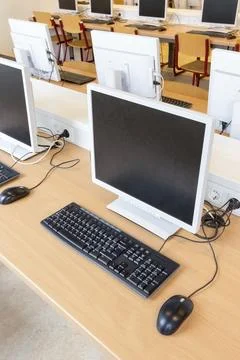 Desktop computer in computer class on dutch high school Stock Photos