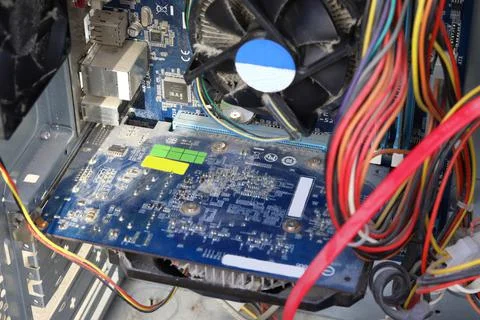 The desktop computer is covered in dust. Dust on the computer board. The CPU  Stock Photos