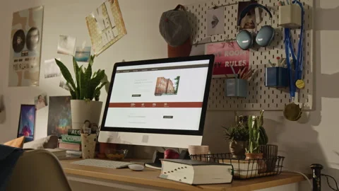 Desktop Computer Displaying University Website for Online Education Stock Footage 338092556